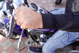 Motorcyclist in protection on a motorcycle close-up
