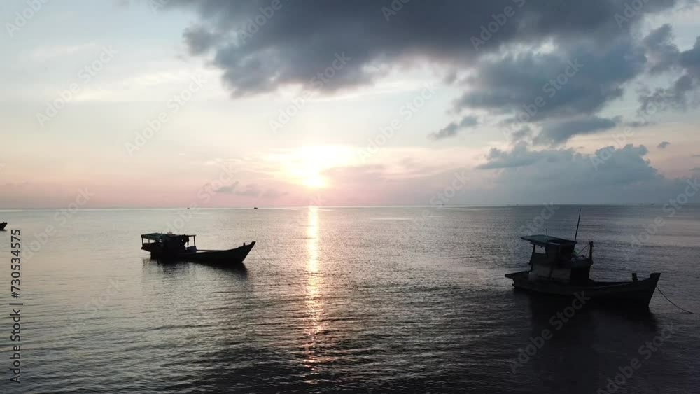 Boats at sea in the early morning Boats at sea in the early morning