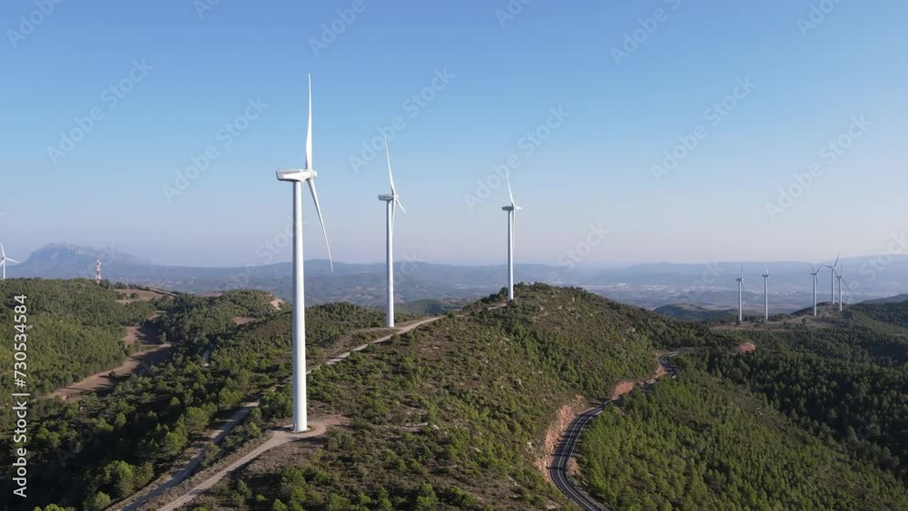 Drone shot of a wind farm for eolic energy production in Catalonia, Spain. Drone shot of a wind farm for eolic energy production in Catalonia, Spain.