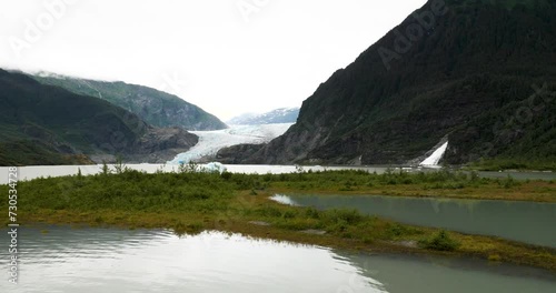 Mendenhall Glacier and Lake, Nugget Falls, McGinnis Mountain and Stroller White Mountain, Slow pan, Alaska. photo