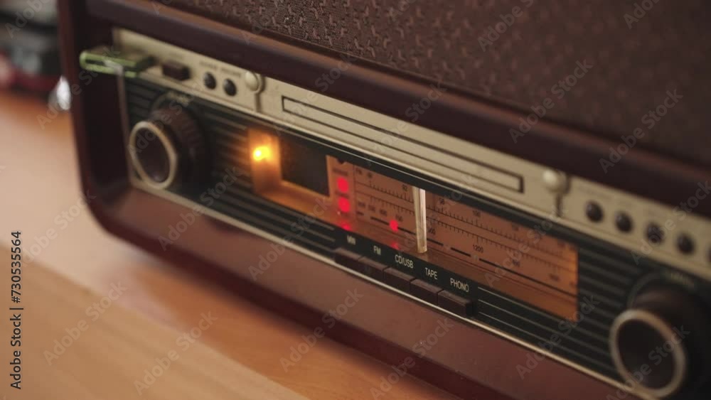 Old radio with station changer. The nostalgia of a rare piece used by enthusiasts and collectors. The player is often found in villages and cottages Old radio with station changer. The nostalgia of a rare piece used by enthusiasts and collectors. The player is often found in villages and cottages