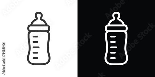 baby bottle icon on black and white 