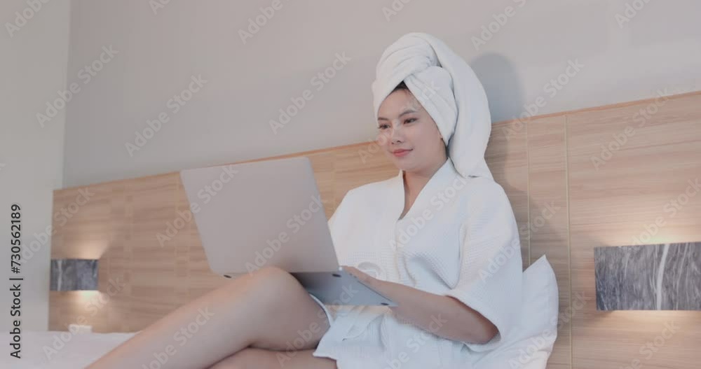 Woman relaxing on bed using laptop computer for video call sitting in her cozy bedroom hello gestured greeting her friend enjoying online conversation, 4k video Woman relaxing on bed using laptop computer for video call sitting in her cozy bedroom hello gestured greeting her friend enjoying online conversation, 4k video