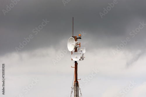 Wireless data station aerial view Against a cloudy sky. Cell tower