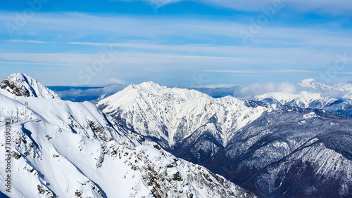 mountain peaks in the snow. Mountains and landscape covered with snow against the sky. Selective focus. © Nikita