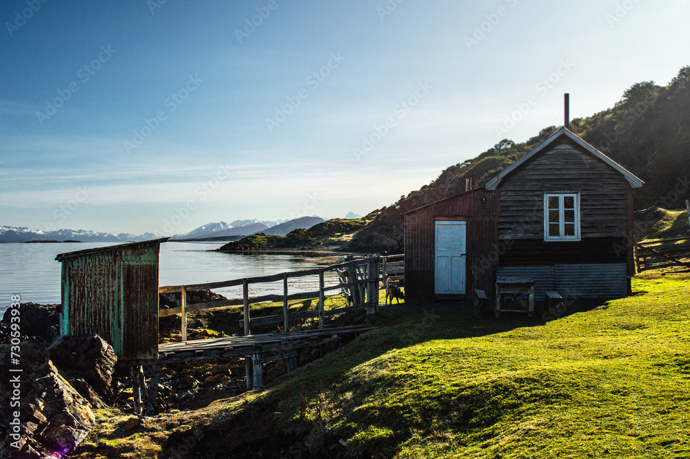 Country house on the coast of the Beagle Channel with the Andes mountain range in the background. Ushuaia, Estancia Tunel