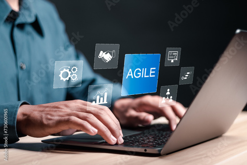 Agile development methodology, Person use laptop with virtual agile icon for process that will help you work faster. Reducing step-by-step work and focusing on team communication.