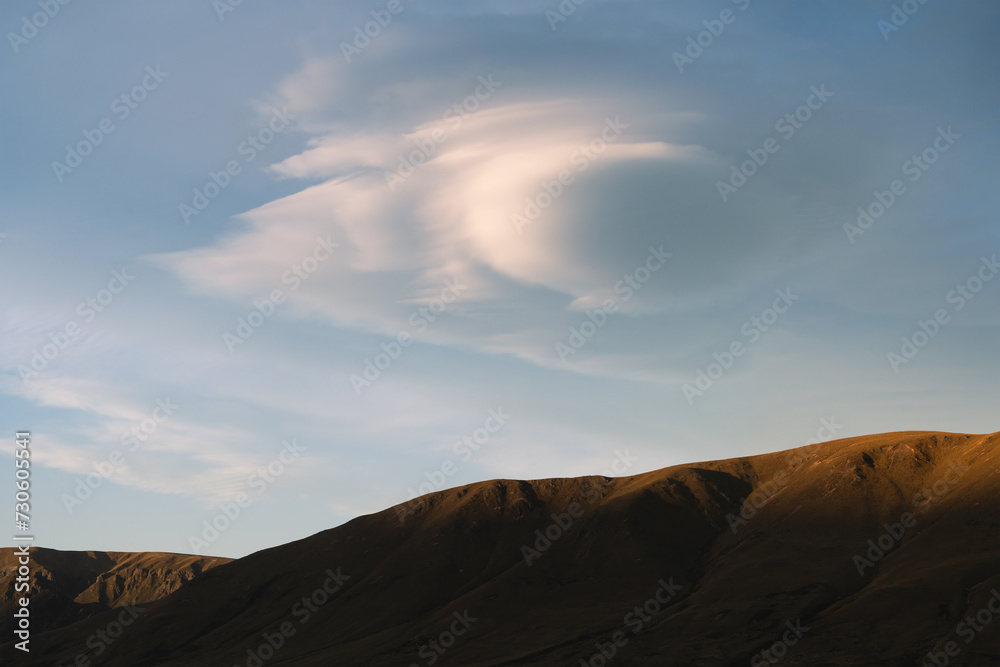 New Zealand landscape of clouds and mountains at sunset New Zealand landscape of clouds and mountains at sunset