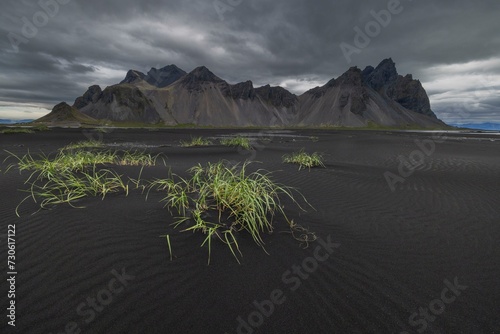 Vestrahorn, mountains with black lava sand, southern Iceland photo