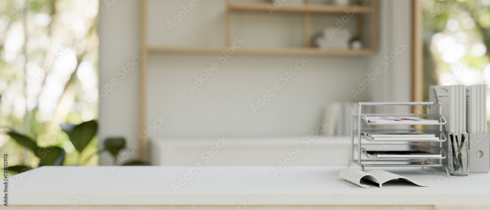 A desk with a document tray, file holders, and space on the table in a modern home office. A desk with a document tray, file holders, and space on the table in a modern home office.