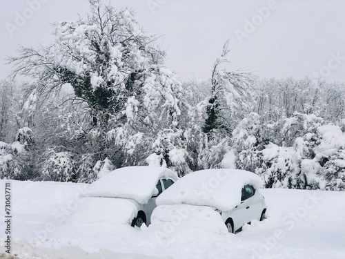 Extreme weather conditions with two cars stuck in the snow