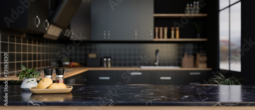A space for displaying your product on a black marble kitchen countertop in a modern black kitchen. photo