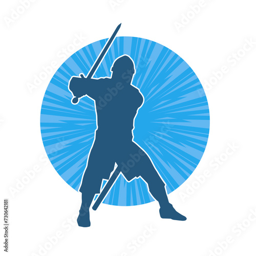 Silhouette of a male warrior wearing war armor suit in action pose using a sword weapon.
