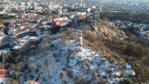 Aerial drone view of the clock tower on top of Sahat Tepe. Clock Hill covered in snow in Plovdiv, Bulgaria photo