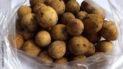 Sweet duku fruit that belong to the meliaceae tribe from western southeast asia photo