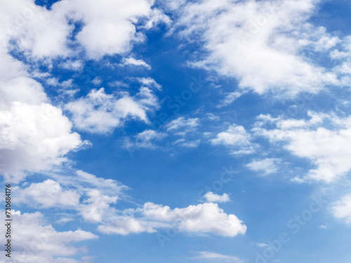 Blue sky with white fluffy cloud. Cloudscape background. Beautiful nature. Freedom of life, New life beginning and Positive thought energy concept. © Maliflower73