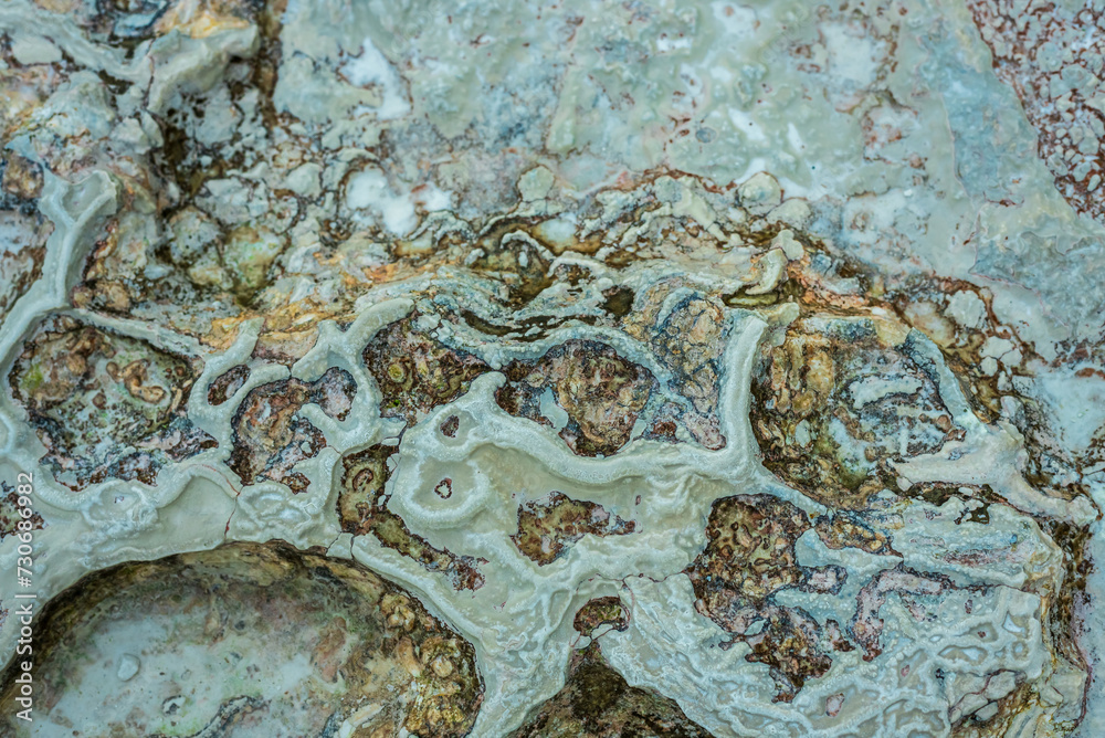 Textured background of abstract shape limestone deposits of travertine Pamukkale. Top view.