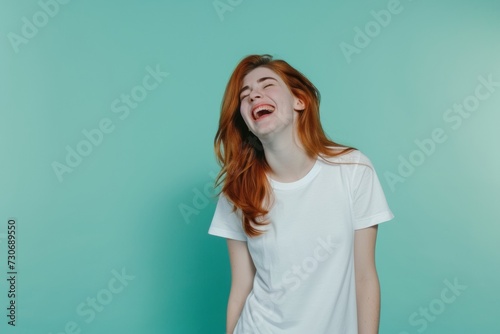 Studio shot of a young woman with blank white t-shirt. T-shirt mockup design