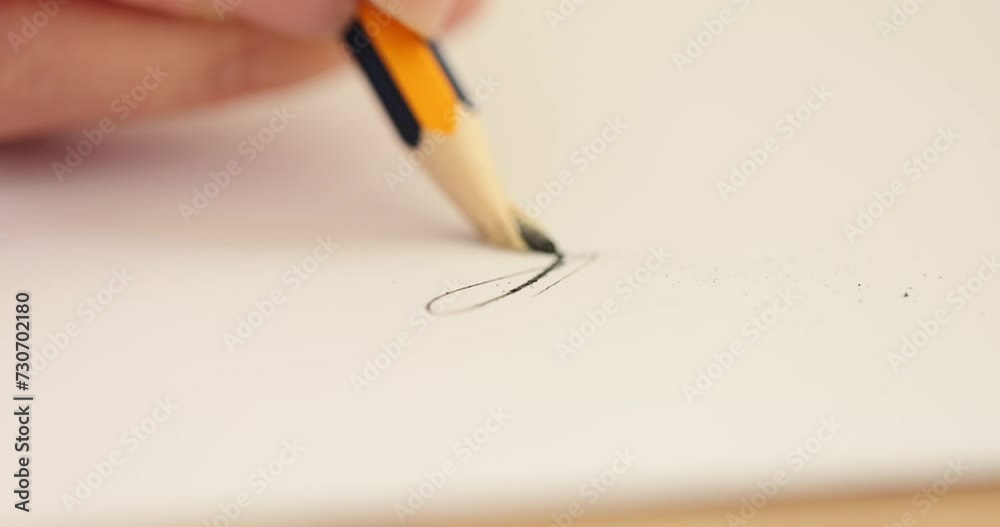 Person draws with pencil on paper and suddenly pencil breaks Person draws with pencil on paper and suddenly pencil breaks