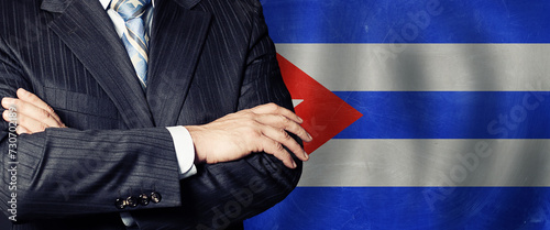 Male hands against Cuban flag background. Education, politics and business in Cuba concept
