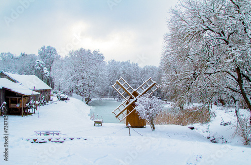 Farms and Farmhouses in the Snow. Windmill. Agriculture and Rural Life at Winter Background. Rural Winter Landscape.