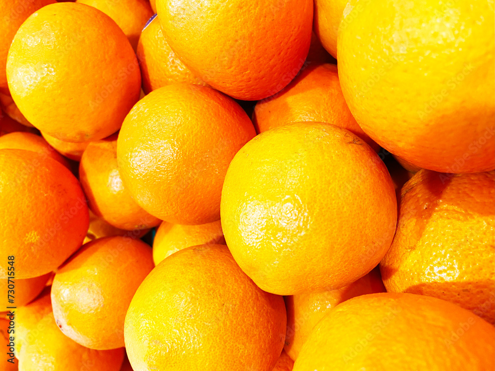 Healthy fruits, orange fruits background many orange fruits - orange fruit background in a supermarket super store Healthy fruits, orange fruits background many orange fruits - orange fruit background in a supermarket super store