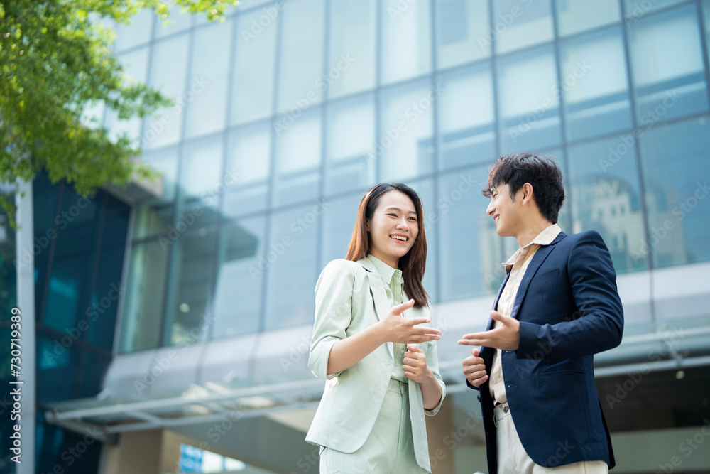Photo of two young Asian businesspeople Photo of two young Asian businesspeople