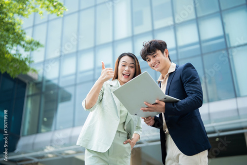 Photo of two young Asian businesspeople