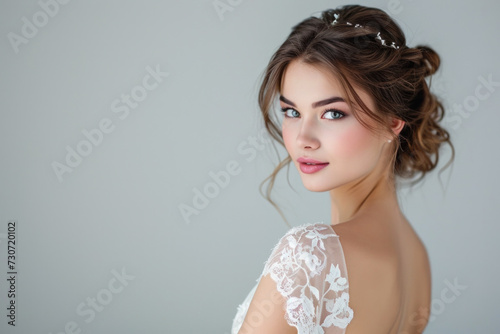 Elegant bride in lace wedding dress with delicate makeup. Bridal beauty and elegance.