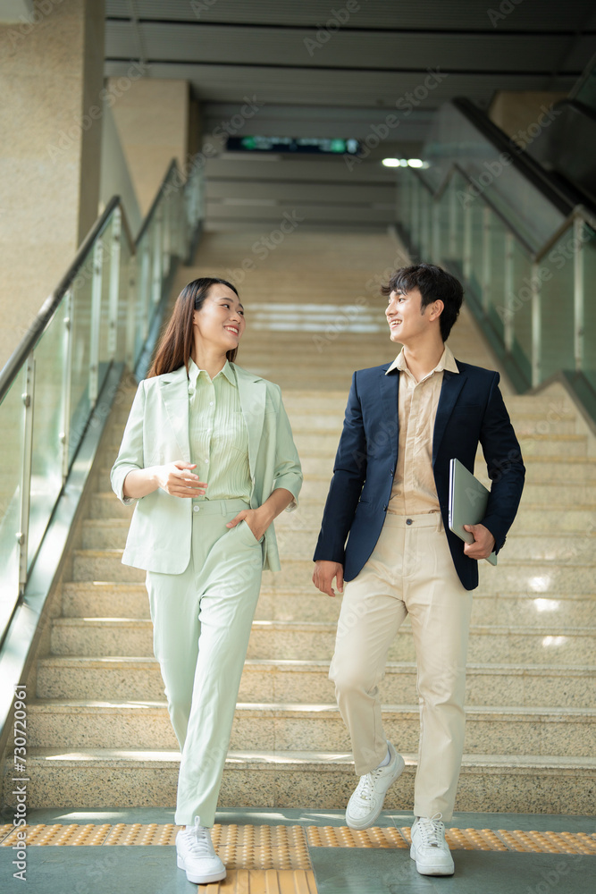 Photo of two young Asian businesspeople