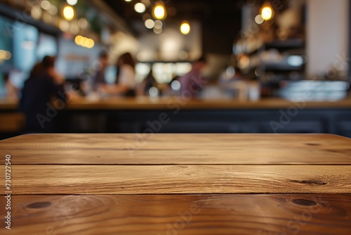 centered wood table, people ordering at blurred cafe counter © primopiano