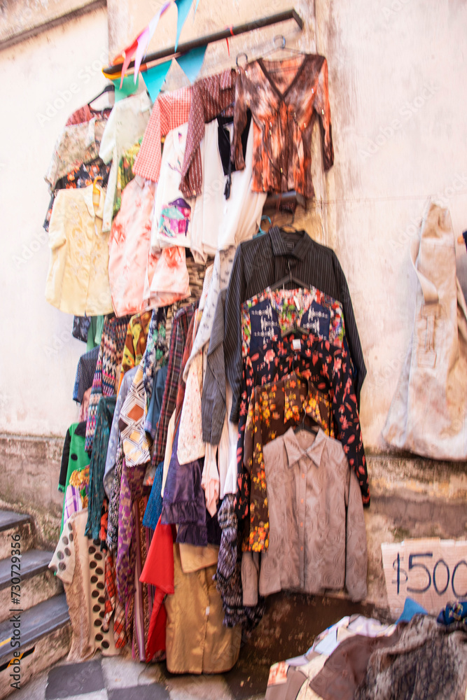 Thrift clothes in an open market