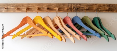 Individual transforming wooden hanger with DIY color alteration for home decor.