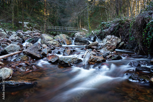 River stream with motion blur effect in winter photo