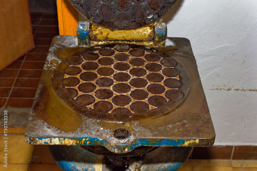 Machine for pressing fresh dough into muffins.