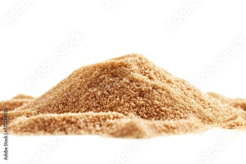 A pile of brown sugar sitting on top of a white surface. Perfect for food and cooking related projects