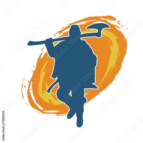 Silhouette of a male warrior carrying broad bladed war axe. Silhouette of a viking warrior with bearded axe weapon in action pose.