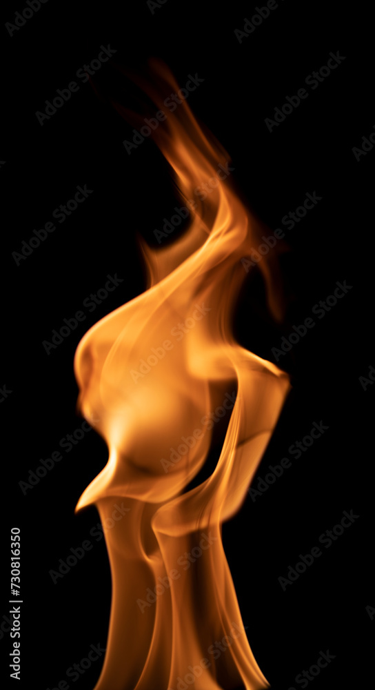 Long flames of fire on a black background