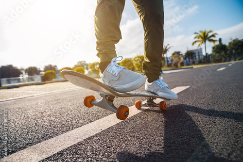 Skateboard on asphalt road in city