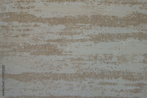 Surface of beige semi-smooth wall with stucco lace finish