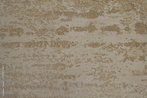 Texture of beige semi-smooth wall with stucco lace finish