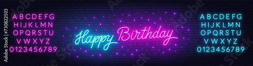 Happy Birthday neon text on brick wall background