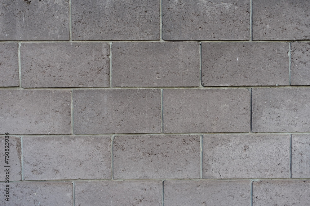 Surface of wall made of gray concrete masonry units Surface of wall made of gray concrete masonry units