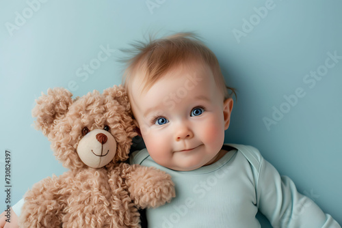 portrait of a child with a toy, Baby with Teddy Bear, Cheerful Infant Portrait, Blue Background