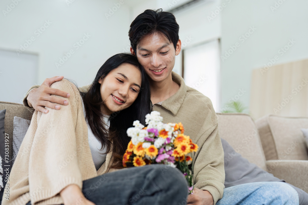 Young couple Hug and giving flower on Valentine's Day. Romantic day together. Valentine's Day concept Young couple Hug and giving flower on Valentine's Day. Romantic day together. Valentine's Day concept