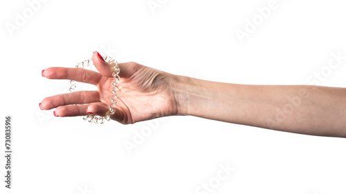 Spiral rubber band in hand. Elastic hair tie on white background.