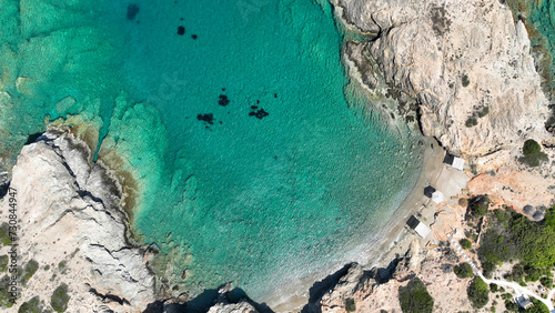 Aerial drone photo of paradise secluded beach of Agios Petros located in long peninsula of small island of Schoinousa, Small Cyclades, Greece