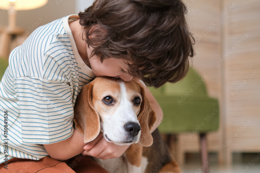 tender hug from a child to his beagle, an image that captures the