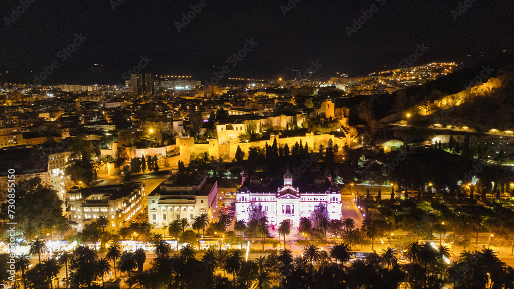 Malaga, Spain cityscape at the City Hall and Alcazaba citadel of Malaga.