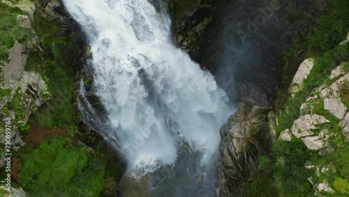 Slow motion drone shot of Toxa Waterfall (Fervenza do Toxa) in Silleda, Pontevedra, Spain photo